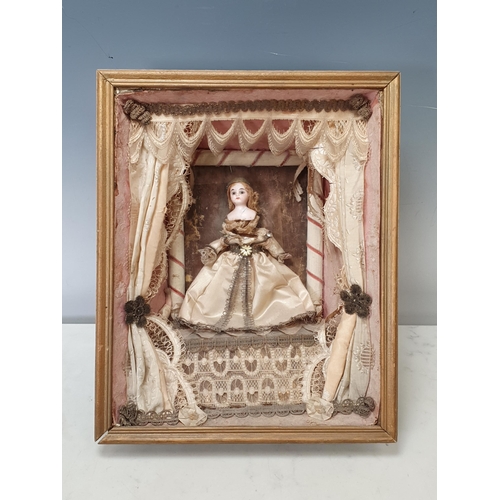 395A - A 19th Century Doll's Diorama with porcelain headed Doll in silk dress standing on stage with theatr... 