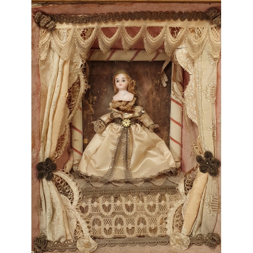 395A - A 19th Century Doll's Diorama with porcelain headed Doll in silk dress standing on stage with theatr... 