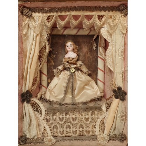 395A - A 19th Century Doll's Diorama with porcelain headed Doll in silk dress standing on stage with theatr... 