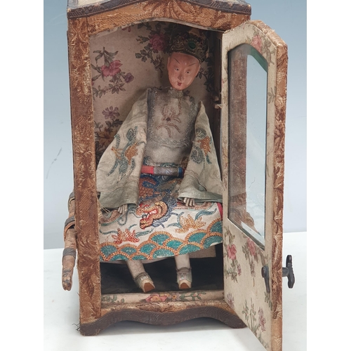 396 - A Doll's Sedan Chair with shaped top, bevelled glass panels, the outside covered in floral tapestry ... 