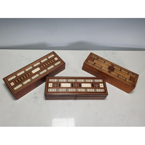 403 - Two 19th Century parquetry Cribbage Boxes with hinged covers and containing bone dominoes and an inl... 