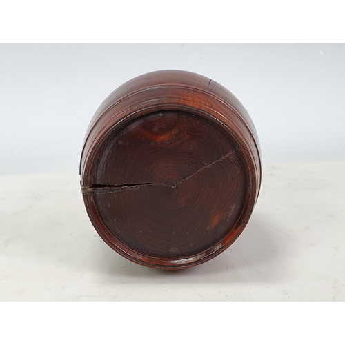 432 - A turned yew wood Tobacco Barrel and Cover (split to cover), containing six pipe stoppers, 4in H