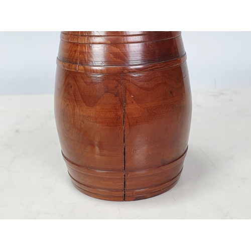 432 - A turned yew wood Tobacco Barrel and Cover (split to cover), containing six pipe stoppers, 4in H