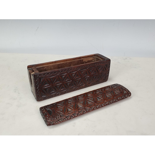 448 - A chip-carved rectangular Box with sliding cover, hollowed from a single piece of possibly chestnut,... 