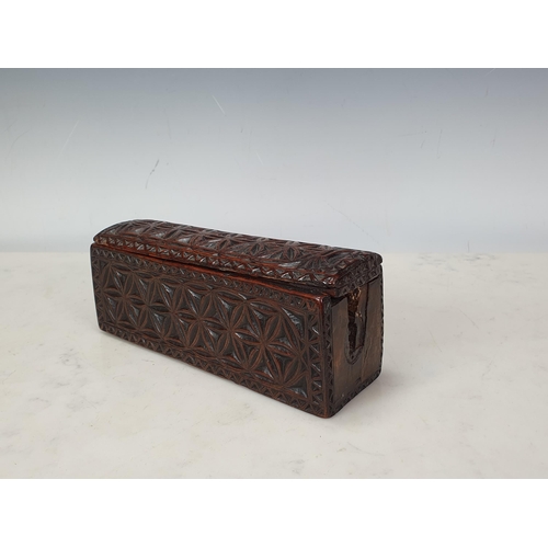 448 - A chip-carved rectangular Box with sliding cover, hollowed from a single piece of possibly chestnut,... 