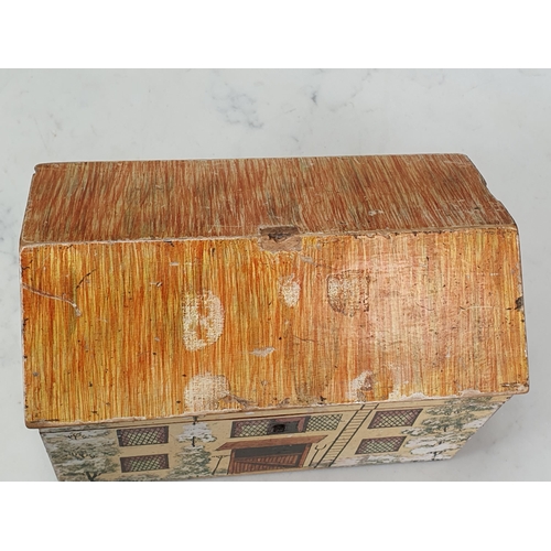 450 - A Folk Art Work Box in the form of a cottage with painted design, the pitched roof hinged cover cont... 