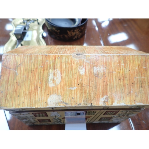 450 - A Folk Art Work Box in the form of a cottage with painted design, the pitched roof hinged cover cont... 