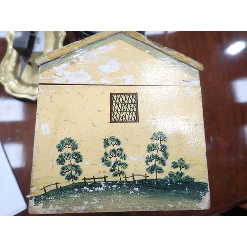 450 - A Folk Art Work Box in the form of a cottage with painted design, the pitched roof hinged cover cont... 