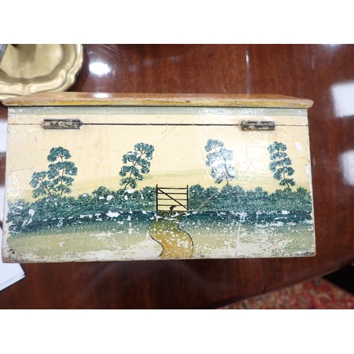 450 - A Folk Art Work Box in the form of a cottage with painted design, the pitched roof hinged cover cont... 