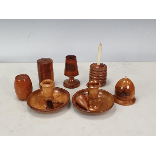 457 - An olive wood 'Brighton Bun' Travelling Candle Set, a German pitch pine Match Holder 'Covent Garden'... 