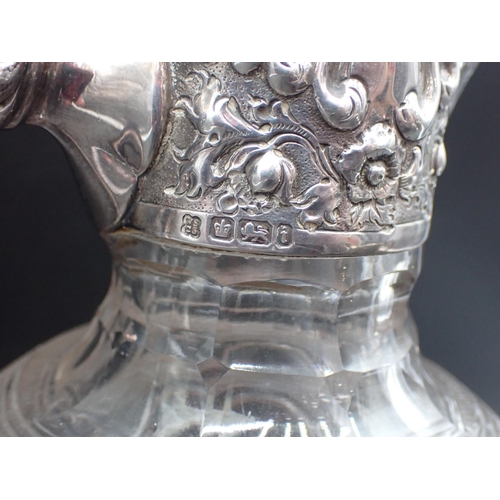 46 - An Edward VII silver mounted and lidded glass Claret Jug with floral and gadroon embossing, Sheffiel... 