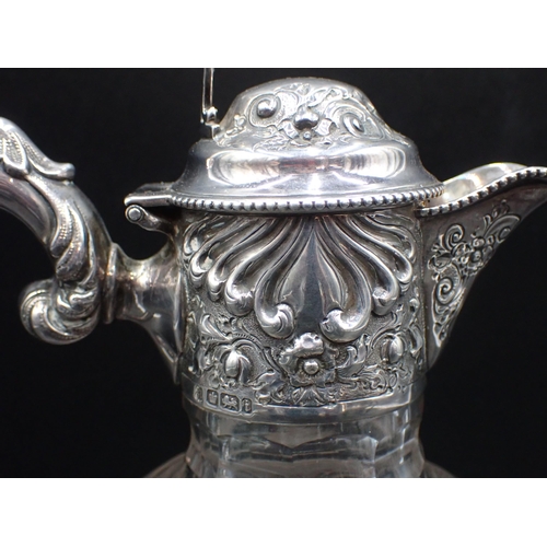 46 - An Edward VII silver mounted and lidded glass Claret Jug with floral and gadroon embossing, Sheffiel... 