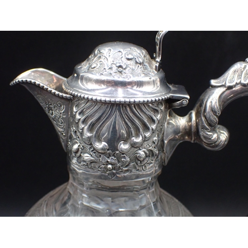 46 - An Edward VII silver mounted and lidded glass Claret Jug with floral and gadroon embossing, Sheffiel... 