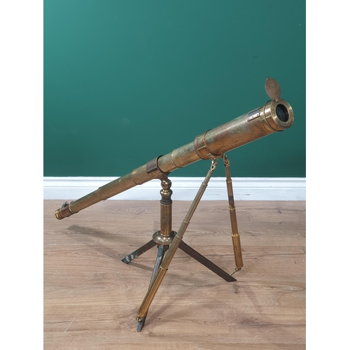 479 - A mid 19th Century brass Telescope by Dolland, London, on a tripod base, telescopic supports, with n... 