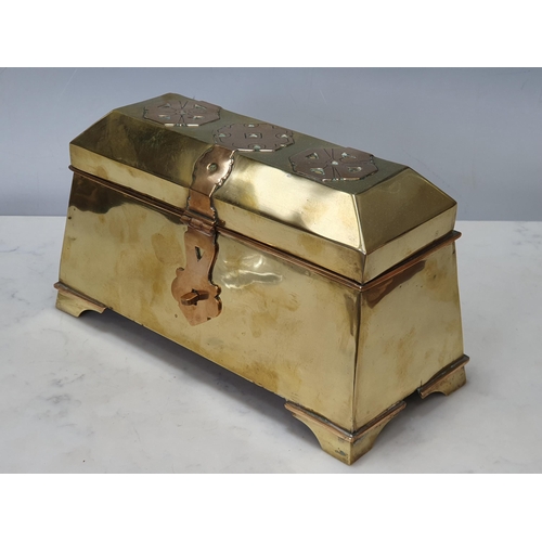 500 - An Arts and Crafts Sarcophagus Box the tapering body with applied strapping and Celtic Emblems on br... 