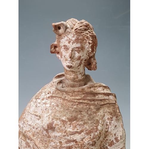 506 - A Tanagra, South Italian terracotta Figure of lady dressed in flowing robes, on square wooden plinth... 