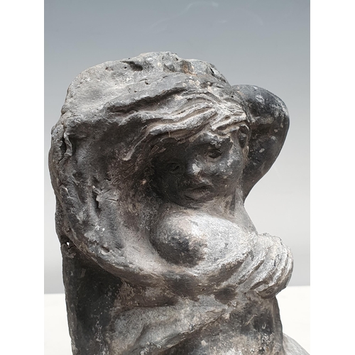 512 - A 19th Century lead Water feature in the form of cherub riding a dolphin, 9in H