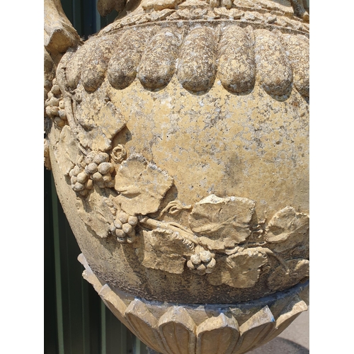 514 - A large pair of reconstituted Garden Urns and Covers on pedestal and plinth bases, having pineapple ... 