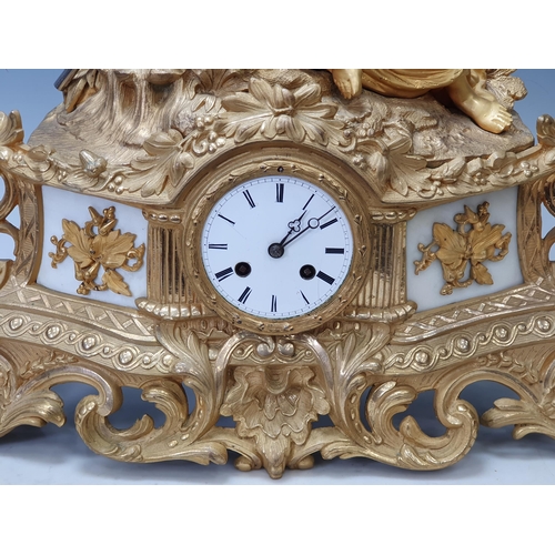 520 - A 19th Century French gilt metal Figural Mantle Clock with neo-classical maiden surmount, white meta... 