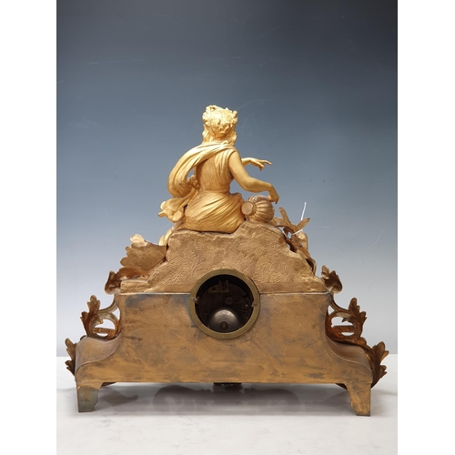 520 - A 19th Century French gilt metal Figural Mantle Clock with neo-classical maiden surmount, white meta... 