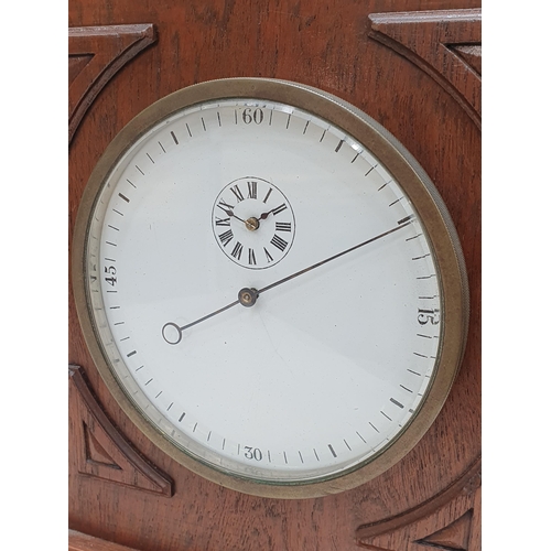 521 - An Arts and Crafts style oak Mantel Clock the circular dial and pierced surmount, 14in H