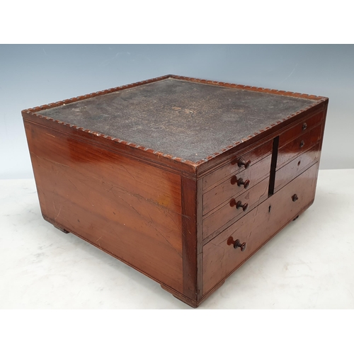 534 - A good quality Dentist's walnut Cabinet with tray top above double-sided arrangement of six small sh... 