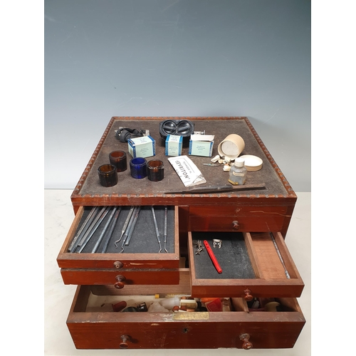 534 - A good quality Dentist's walnut Cabinet with tray top above double-sided arrangement of six small sh... 