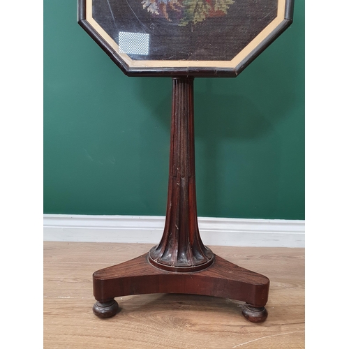 549 - A 19th Century rosewood Pole Screen with brass bar supporting the octagonal tapestry panel with stop... 