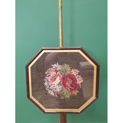 549 - A 19th Century rosewood Pole Screen with brass bar supporting the octagonal tapestry panel with stop... 