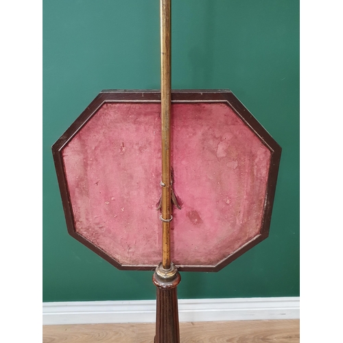 549 - A 19th Century rosewood Pole Screen with brass bar supporting the octagonal tapestry panel with stop... 