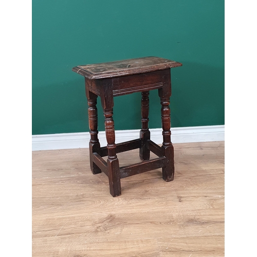 550 - An antique oak Joined Stool in the 17th Century style with moulded top on turned and squared support... 