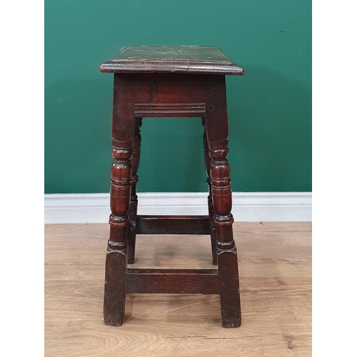 550 - An antique oak Joined Stool in the 17th Century style with moulded top on turned and squared support... 