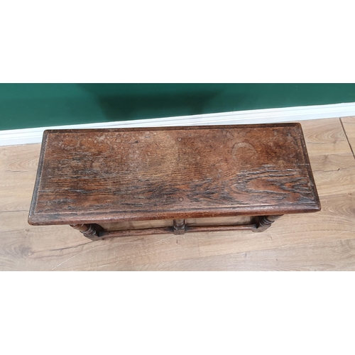 551 - An antique oak Joined Stool in 17th Century style with moulded top above a shaped frieze and raised ... 