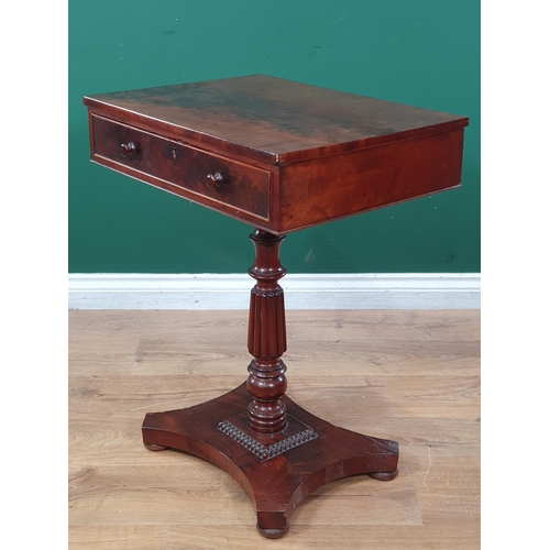 553 - An early 19th Century mahogany Work Table, the rectangular top fitted frieze drawer raised on turned... 