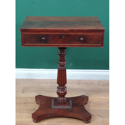 553 - An early 19th Century mahogany Work Table, the rectangular top fitted frieze drawer raised on turned... 