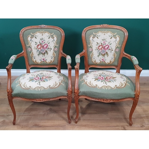 559 - A pair of French beechwood framed open Elbow Chairs with green rose decorated needlework upholstery ... 