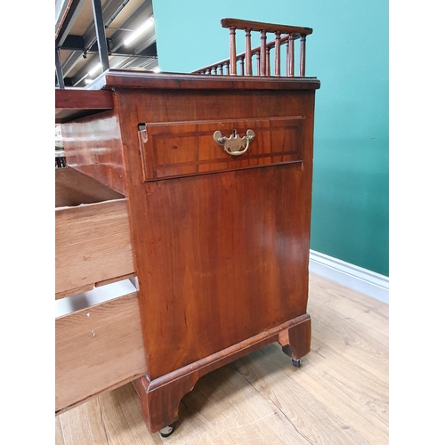 560 - An antique walnut Chest with spindle gallery, brushing slide above two feather banded drawers and tw... 