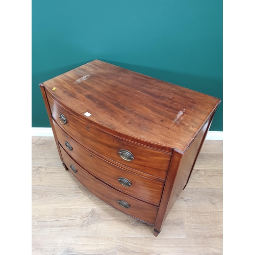 563 - A Regency mahogany bowfront Chest of three long drawers flanked by squared columns and raised on squ... 