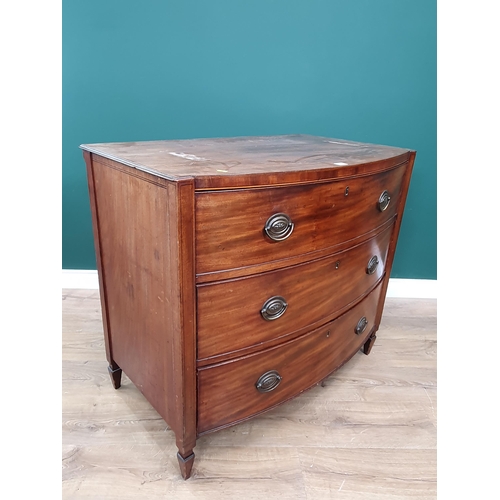 563 - A Regency mahogany bowfront Chest of three long drawers flanked by squared columns and raised on squ... 