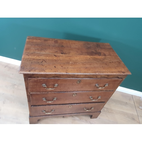 564 - An antique oak Chest of three long graduated drawers with shaped upper frieze, 3ft W