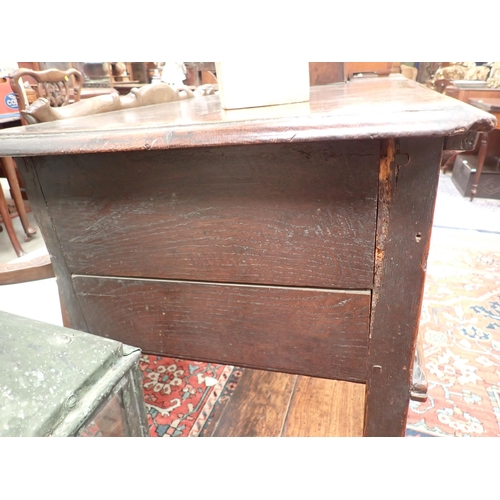 573 - An 18th Century oak Dresser Base fitted three moulded drawers, raised on baluster turned and squared... 