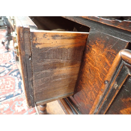 573 - An 18th Century oak Dresser Base fitted three moulded drawers, raised on baluster turned and squared... 