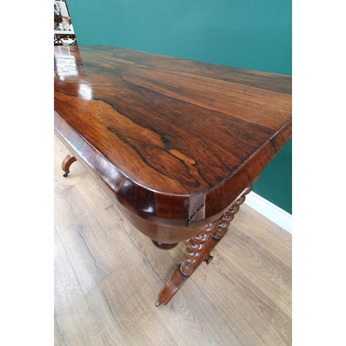 576 - A 19th Century rosewood Centre Table with rounded rectangular top, raised on pairs of spiral support... 