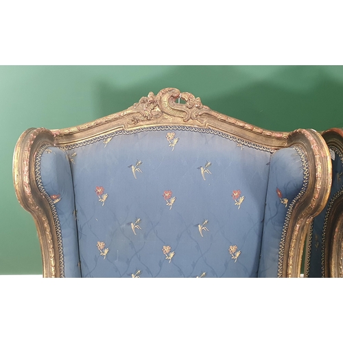 578 - A pair of French gilt framed and blue upholstered Armchairs with pierced and scrolled top rails, win... 