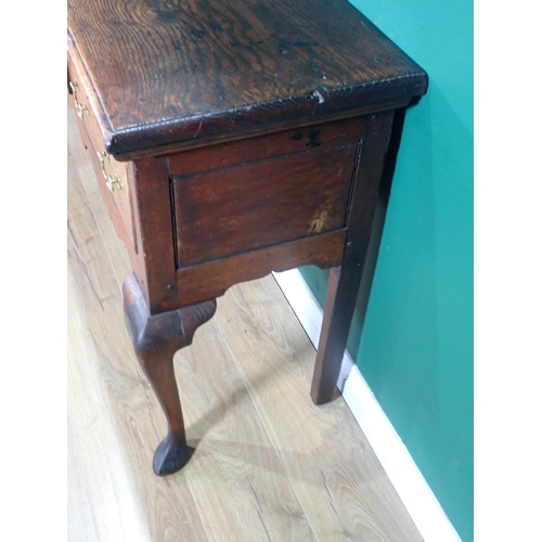 582 - An 18th Century oak Dresser Base with thick moulded top fitted three frieze drawers above shaped apr... 