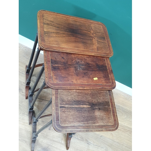 585 - A 19th Century Nest of three rosewood and satinwood strung Occasional Tables with rounded corners mo... 