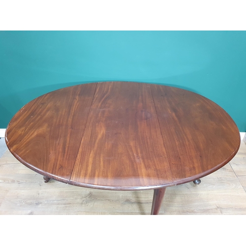 587 - A George II mahogany dropleaf Dining Table mounted upon turned tapering legs and pad feet with later... 