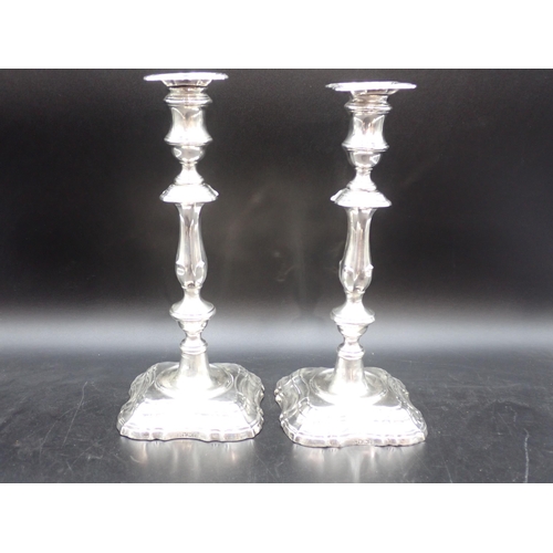 59 - A pair of Edward VII silver Candlesticks with knopped stems on shaped square bases, Sheffield 1906, ... 