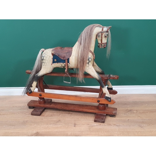 592 - An antique dappled palomino Rocking Horse of small proportions in the manner of Lines on pine slidin... 