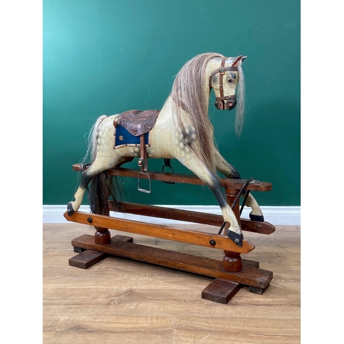 592 - An antique dappled palomino Rocking Horse of small proportions in the manner of Lines on pine slidin... 